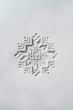 Photo for Ukrainian ornament embossed on a light clay wall. - Royalty Free Image
