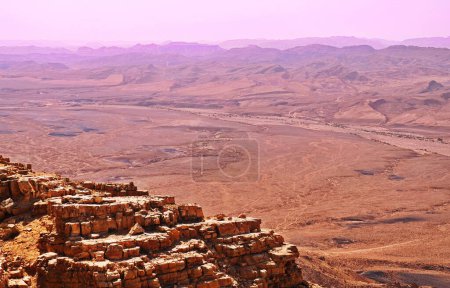 Photo for Makhtesh Ramon is a geological feature of the Israeli Negev Desert. Situated approximately 85 km south of the city of Beersheba, this landform represents the world's largest erosion circus. - Royalty Free Image