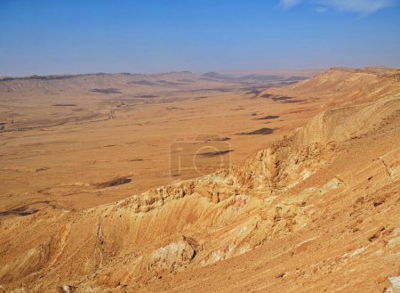 Photo for Makhtesh Ramon is a geological feature of the Israeli Negev Desert. Situated approximately 85 km south of the city of Beersheba, this landform represents the world's largest erosion circus. - Royalty Free Image
