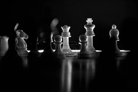 Photo for Chess pieces arranged on the chessboard. Chess player achieving success. Overcoming obstacles, victory. - Royalty Free Image