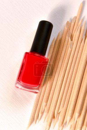 Photo for Nail polish and wooden sticks for manicure and pedicure - Royalty Free Image
