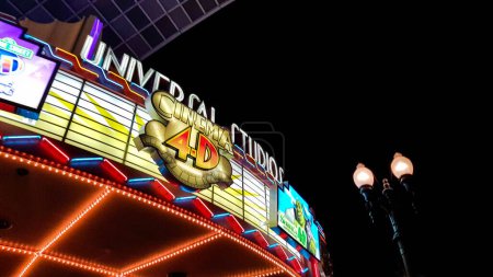 Photo for Osaka, Japan in July 2022. Sign of Universal Studio Cinema 4D shining brightly at night at Universal Studios Japan. When watching there will be effects of wind, water spray, moving chairs, 4D screens - Royalty Free Image