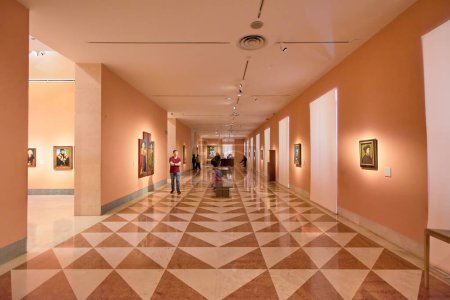 Photo for MADRID SPAIN - July 31, 2023: Exhibition room of the Museo Nacional Thyssen-Bornemisza with people inside observing the works. - Royalty Free Image