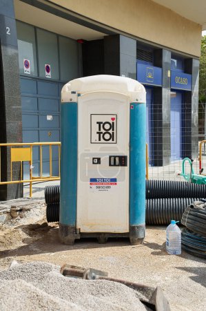 Photo for Viladecans, Spain - September 17, 2023: Portable temporary plastic bathroom for construction work on the street for workers. - Royalty Free Image