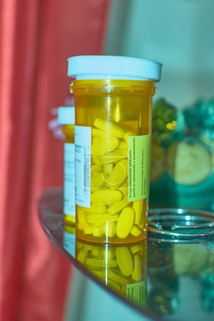 Medicine in transparent container, bright interior.
