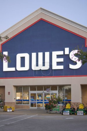 Photo for Florida, USA - March 23, 2024: Shot of a Lowe's store with a clear sky, showing the entrance filled with gardening tools and plants, inviting home improvement enthusiasts. - Royalty Free Image