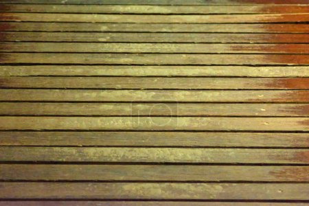 A close-up view of horizontally aligned wooden planks showcasing a rich and detailed texture with natural variations in color and tone.