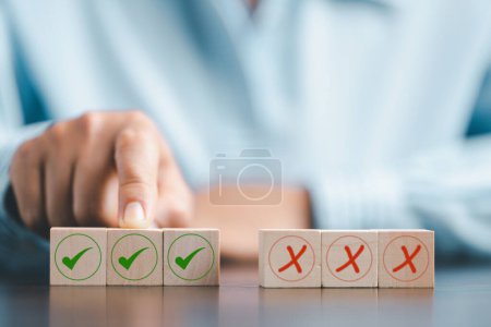 Photo for Concept of right or wrong mark on wooden cubic blocks. Business and lifestyle concept. Think With Yes Or No Choice, Business Choices For Difficult Situations, wooden with right or wrong mark on it. - Royalty Free Image
