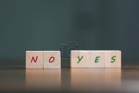 Photo for Concept of choice yes or no on wooden cubic blocks. Business and lifestyle concept. Think With Yes Or No Choice, Business Choices For Difficult Situations, two wooden with yes or no word on it. - Royalty Free Image