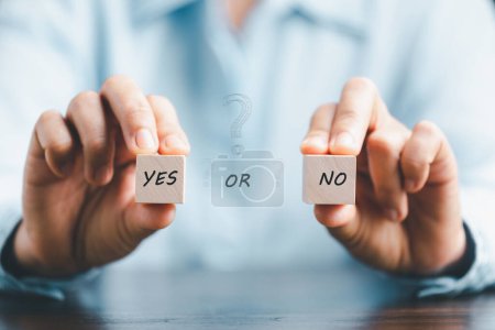 Photo for Concept of choice yes or no on wooden cubic blocks. Think with Yes or No choice, Business choices for difficult situations, Business woman hands holding two wooden with yes or no word on it. - Royalty Free Image