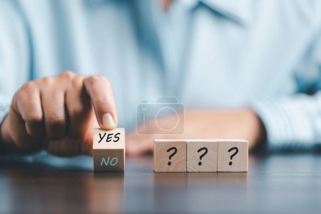 Photo for Concept of choice yes on wooden cubic blocks. Think with Yes or No choice, Business choices for difficult situations, Business woman hands with wooden with yes word on it. - Royalty Free Image