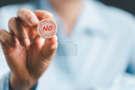 Photo for Concept of choice no on wooden cubic blocks. Think with Yes or No choice, Business choices for difficult situations, Business woman hands holding wooden with no word on it. - Royalty Free Image