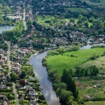 Aerial view of the houses bordering the River Thames at Sunnymeads, Berkshire on a spring afternoon. 