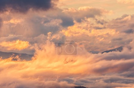 Photo for Colored storm, fog and clouds on the valley at sunset - Royalty Free Image