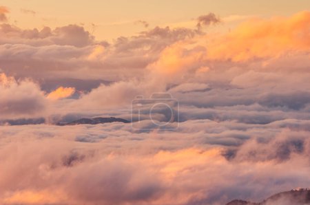 Photo for Colored storm, fog and clouds on the valley at sunset - Royalty Free Image