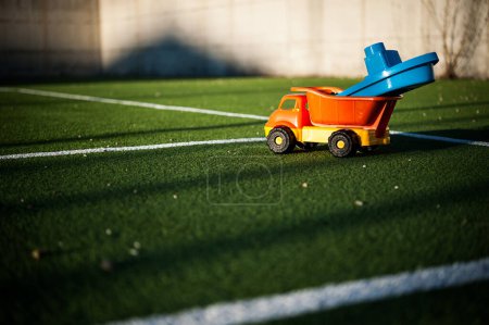 Photo for Toy truck on the yars - Royalty Free Image