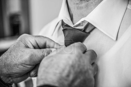 Photo for The father knots the tie to the groom - Royalty Free Image
