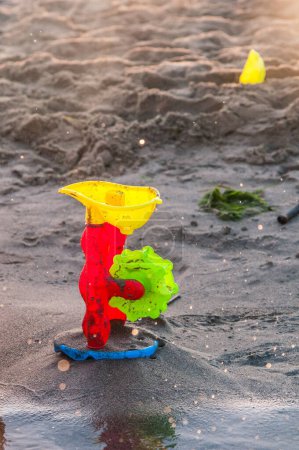 Photo for Toy in the sand on the beach - Royalty Free Image