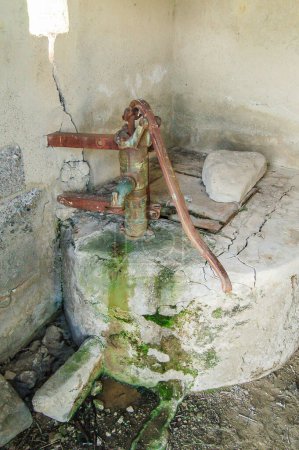 Photo for Hand pump of the water well - Royalty Free Image