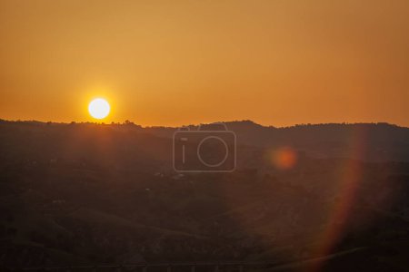 Photo for The sun falling behind the horizon - Royalty Free Image