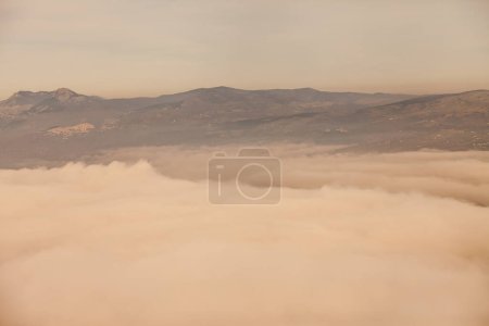 Photo for Cloudy sky and bad weather with mist overhead view - Royalty Free Image
