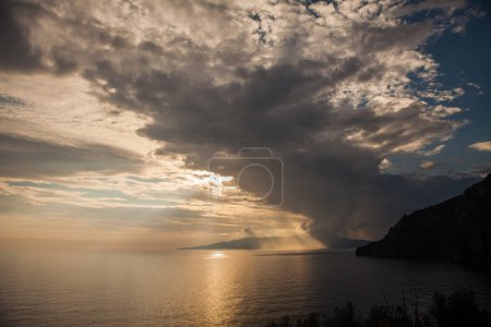 Photo for Sea storm at sunset with behind the island - Royalty Free Image