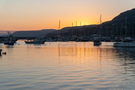 Photo for Boats docked at the pier and Seascape at sunset - Royalty Free Image