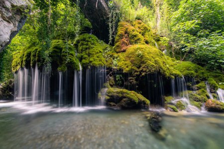 Photo for Lost waterfall inside the forest, enchanting place for real adve - Royalty Free Image