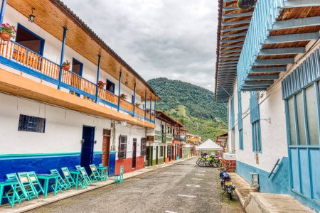 Photo for Jardin, Colombia - May 2019: Vintage colorful colonial houses in the street of Jardin, Colombia - Royalty Free Image