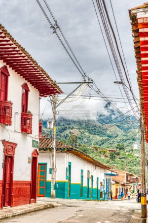 Photo for Jardin, Colombia - May 2019: red colonial houses in the street of Jardin, Colombia - Royalty Free Image