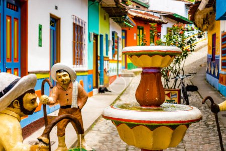 Photo for Guatape, Colombia - April 2019 : Colorful houses in cloudy weather, HDR image - Royalty Free Image