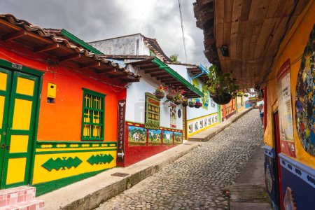 Photo for Guatape, Colombia - April 2019 : Colorful houses in cloudy weather, HDR image - Royalty Free Image