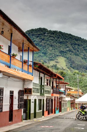 Photo for Jardin, Colombia - May 2019: Historic colonial houses in Jardin, Colombia, showcase the town's cultural heritage with their unique architectural styles and lively colors. - Royalty Free Image