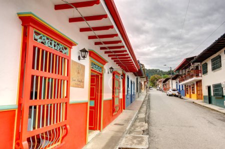 Photo for Jardin, Colombia - May 2019: Historic colonial houses in Jardin, Colombia, showcase the town's cultural heritage with their unique architectural styles and lively colors. - Royalty Free Image