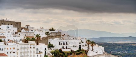 Photo for Vejer de la Frontera, Spain - 1 August 2023 : Beautiful view of Historical city center with ancient buildings in cloudy weather, HDR Image - Royalty Free Image