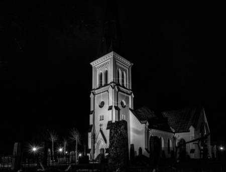 Photo for A church tower lit up at night - Royalty Free Image