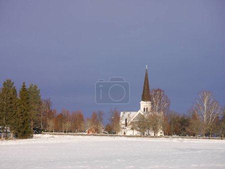 Photo for View of a church on a field at winter - Royalty Free Image