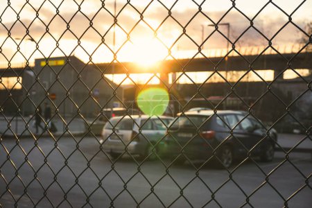 view of a parking lot behind the fence