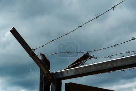 close-up of fence with barbed wire