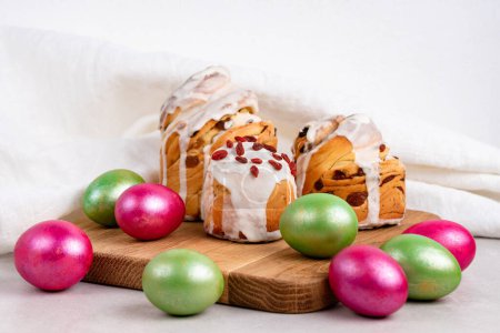 Photo for Easter cruffins with colored green and red Easter eggs - Royalty Free Image