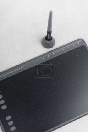Photo for Drawing tablet and stylus on grey background - Royalty Free Image