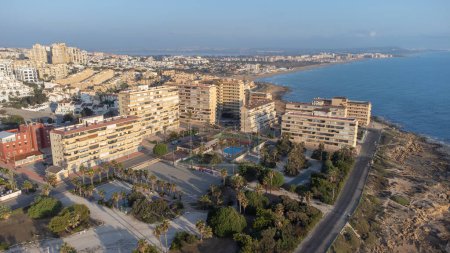Aerial drone photo of apartments by the sea at Cabo Cervera in Torrevieja, Spain