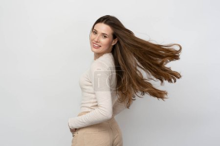 Photo for Portrait of beautiful happy brunette woman with healthy long hair posing for picture isolated on white background. Beauty, hair care concept - Royalty Free Image