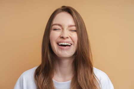 Photo for Portrait of pretty emotional woman laughing isolated on background. People emotions concept - Royalty Free Image