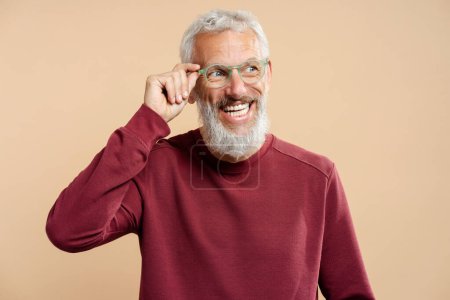 Photo for Portrait smiling bearded mature man, hipster wearing stylish eyeglasses looking away isolated on background - Royalty Free Image