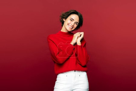 Photo for Portrait of emotional caucasian woman laughing and looking at camera isolated on red background. People emotions concept - Royalty Free Image