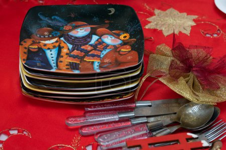 Photo for Decorative Christmas plates and cutlery for preparing the festive table - Royalty Free Image