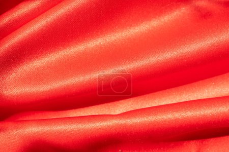 Photo for Red polyester canvas, naturally lit, textured background. - Royalty Free Image