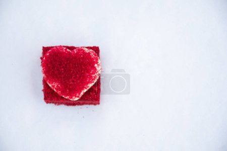 Photo for Heart shaped cookie on snow, white copy space - Royalty Free Image