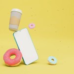 online payment for coffee and donuts. smartphone, a glass of coffee and donuts on a yellow background. 3D render.